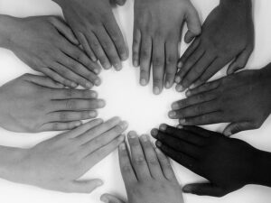 A circle of hands in shaded color